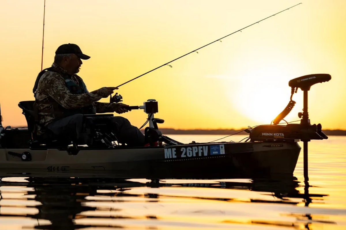 Man fishing as the sun sets after finding the best trolling motor for a kayak.